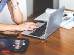 image of a person and a laptop