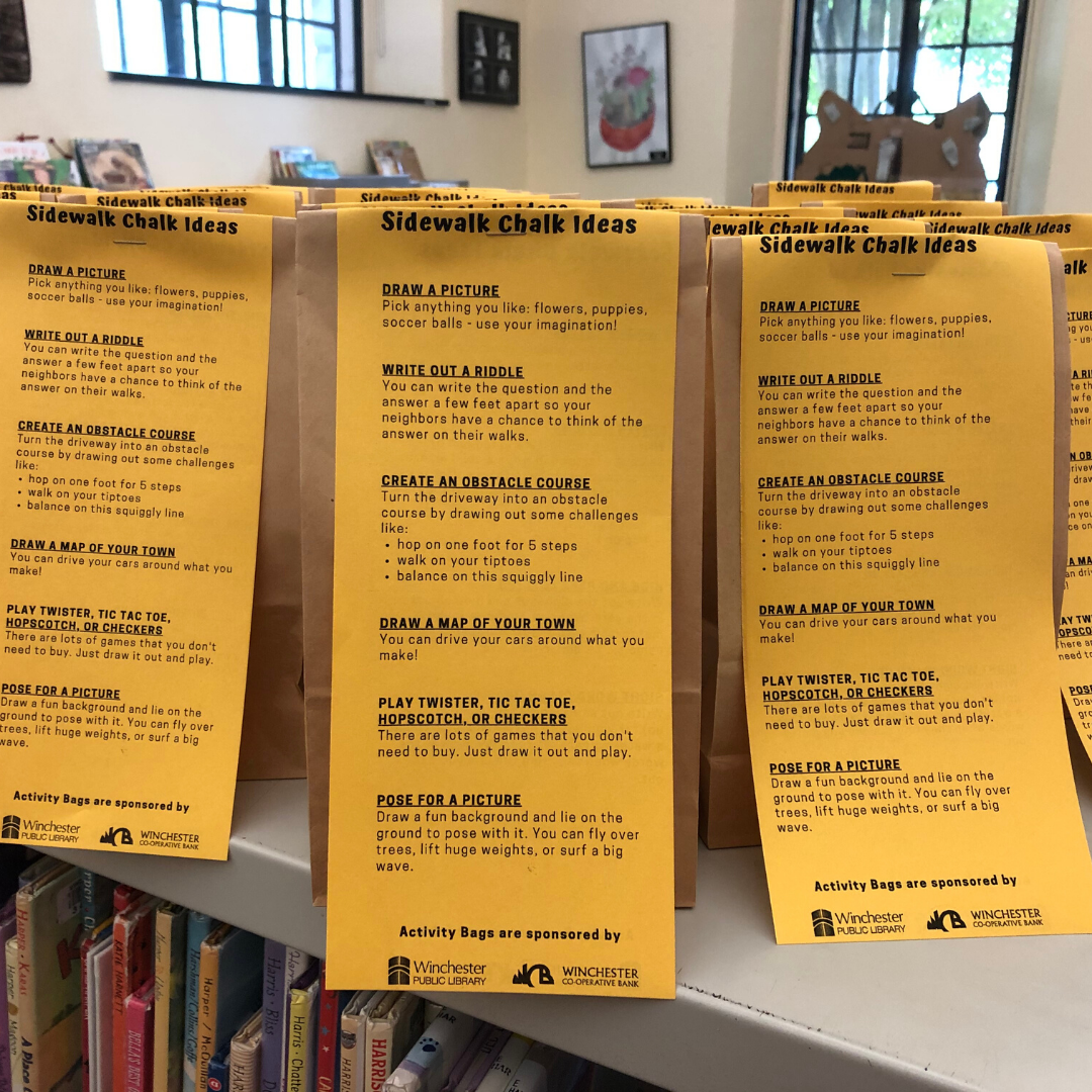 photo of several paper bags with yellow slips of paper stapled to them