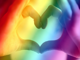 image of a hand heart and rainbow