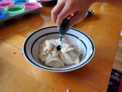 photo showing color being added to cupcake batter