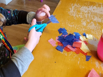 child preparing tissue paper