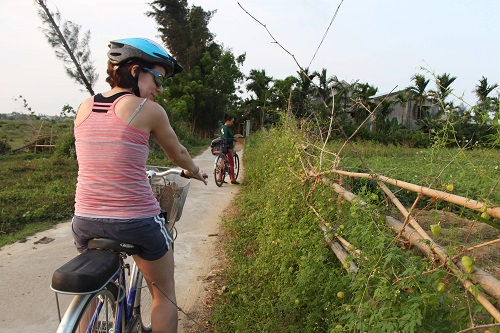 photo of woman on a bike