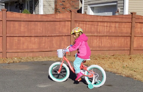 photo of child on a bike