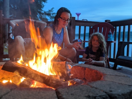 photo of a family around a campfire