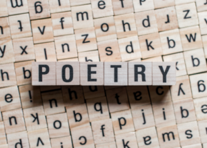 photo of word tiles spelling out the word poetry