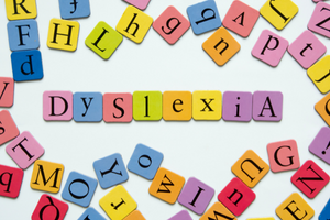 image of tiles spelling dyslexia